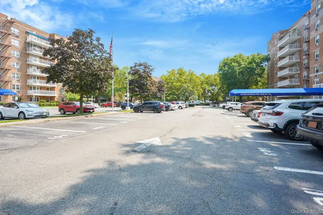 a view of street with parked cars