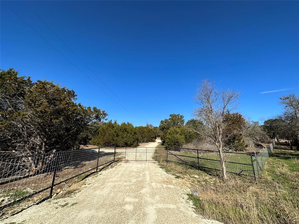 0 County Road 272 Bertram, TX 78605 - Photo 1 of 1 a view of a backyard with trees