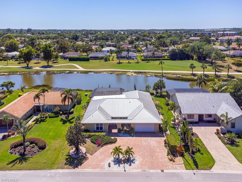 226 Torrey Pines Point Naples, FL 34113 - Photo 2 of 27 Drone / aerial view with a residential view and a water view