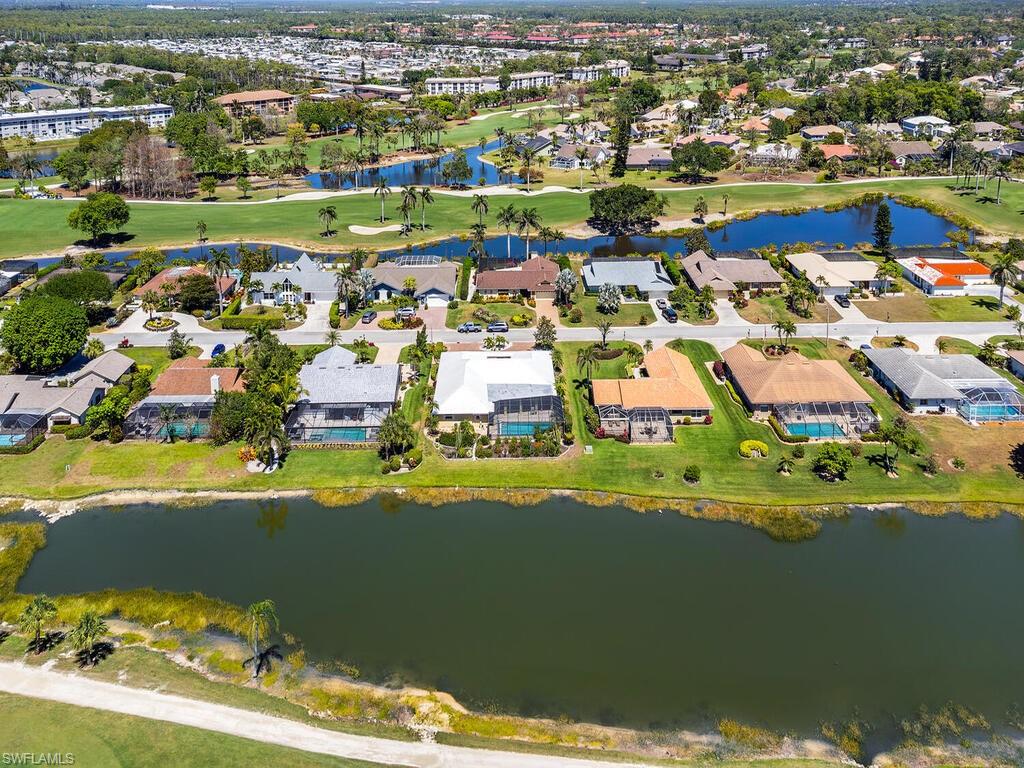 226 Torrey Pines Point Naples, FL 34113 - Photo 5 of 27 Aerial view with a water view and a residential view