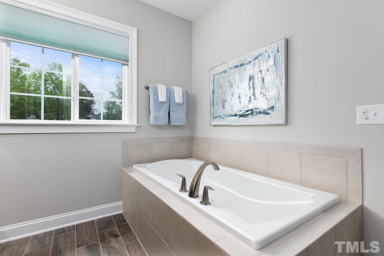 1612 Yates Wheel Way Raleigh, NC 27606 - Photo 18 of 30 1612 Yates Wheel Way - Luxury bath with separate soaking tub