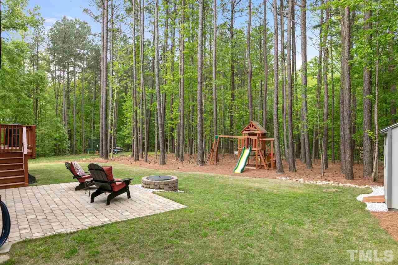 1612 Yates Wheel Way Raleigh, NC 27606 - Photo 30 of 30 1612 Yates Wheel Way - Backyard with lot backing to woods