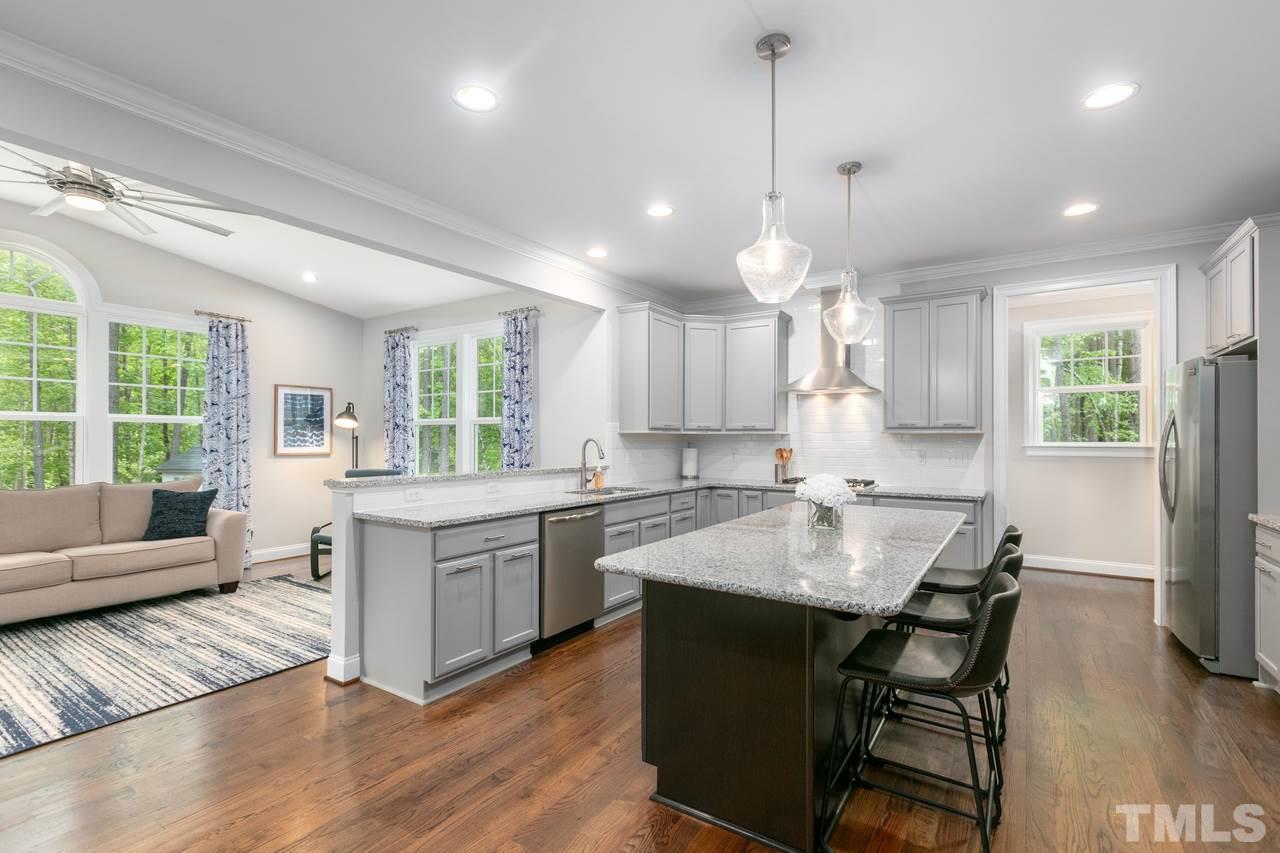 1612 Yates Wheel Way Raleigh, NC 27606 - Photo 6 of 30 1612 Yates Wheel Way - Gourmet Kitchen looking into sun room