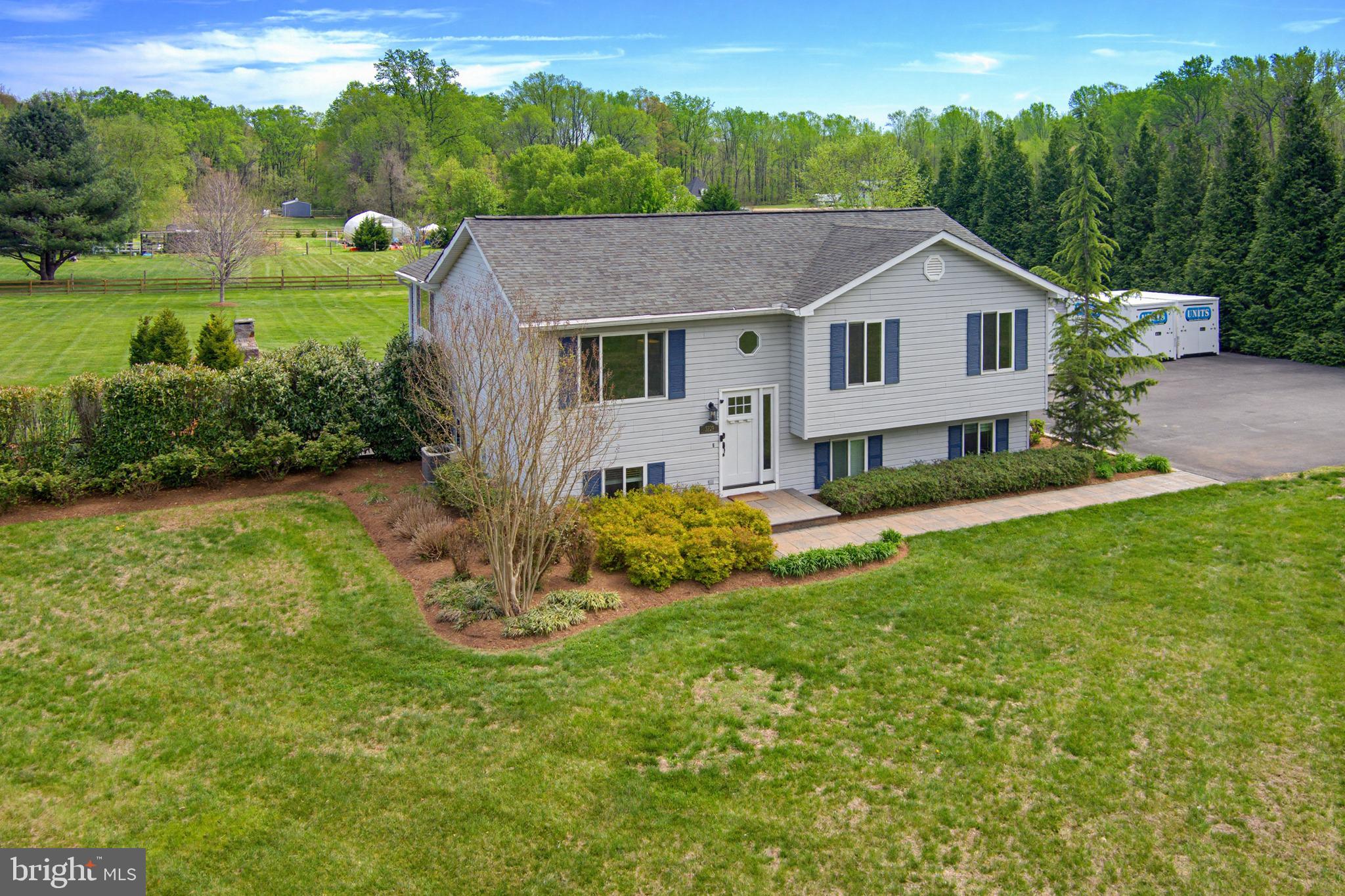 3229 Beards Point Road Davidsonville, MD 21035 - Photo 4 of 69 a aerial view of a house next to a big yard and large trees