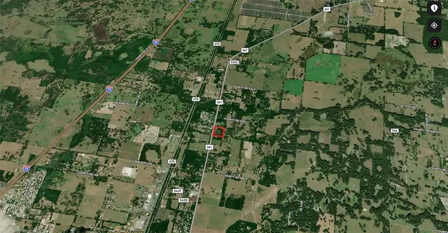 a view of a swimming pool and trees in the background