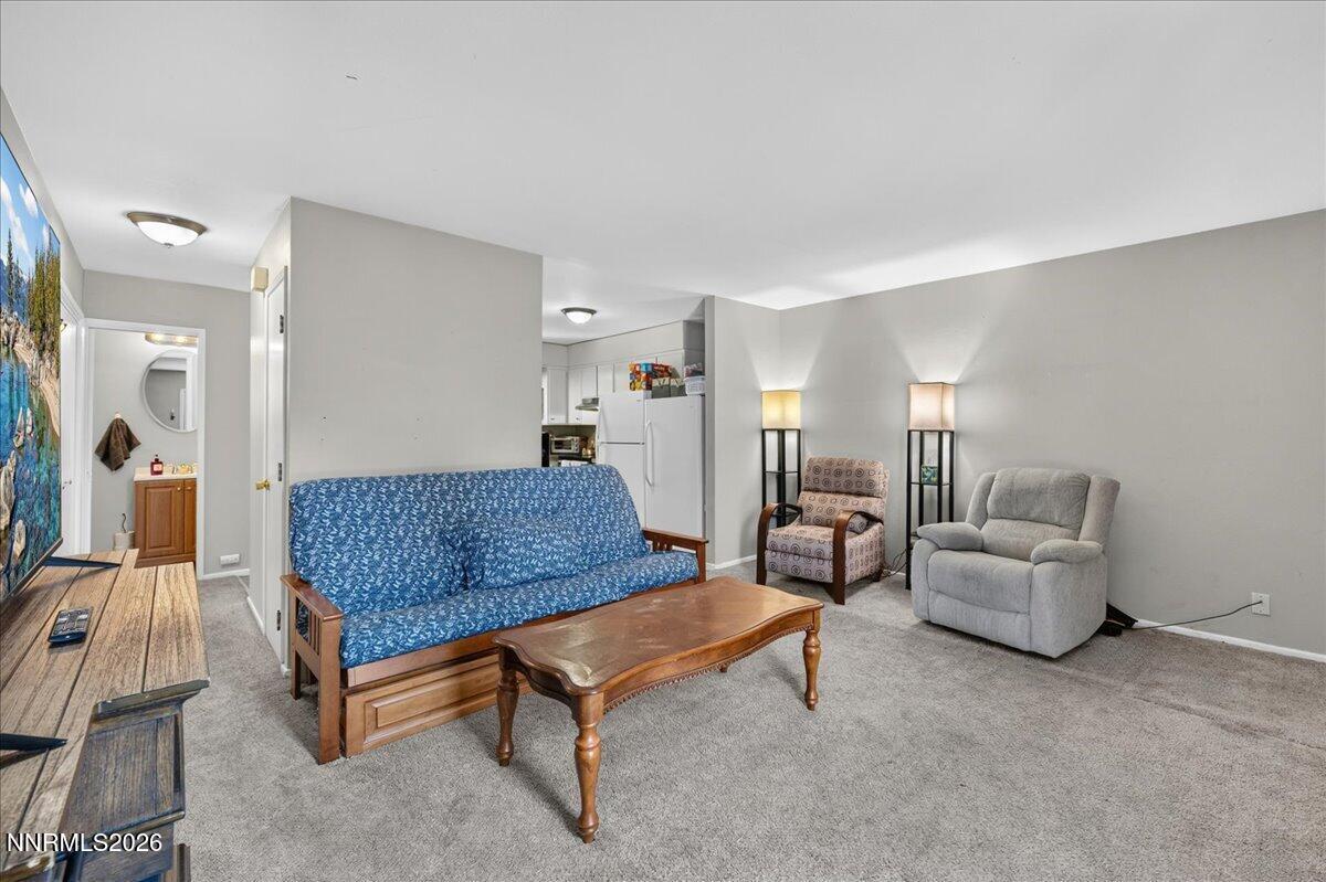 5 Smithridge Park Reno, NV 89502 - Photo 3 of 24 a living room with furniture and a couch