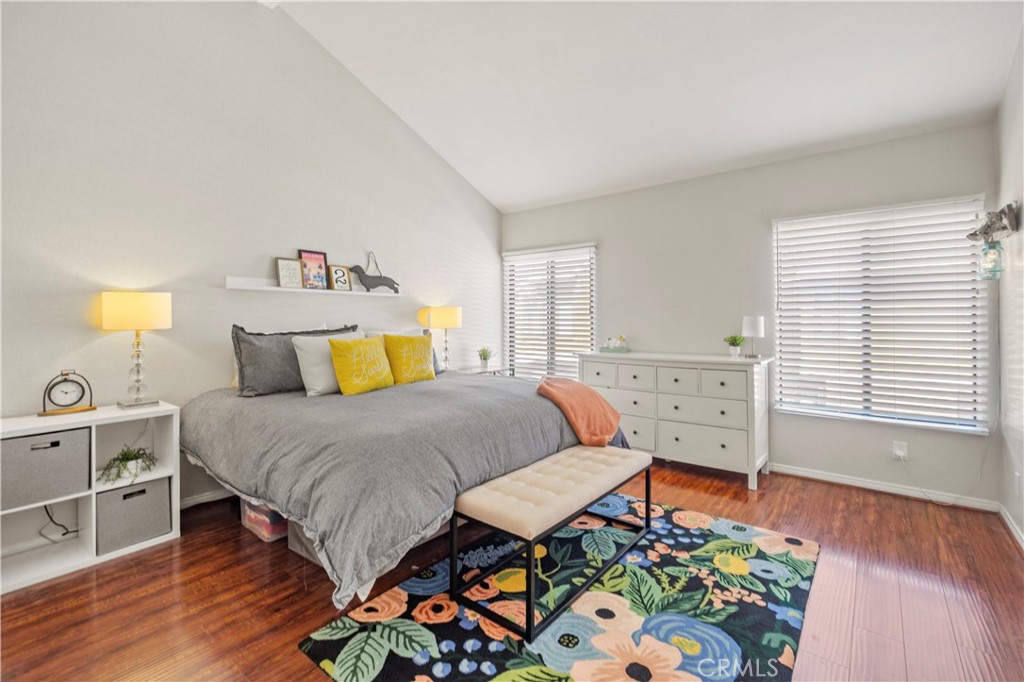8520 Lake Knoll Avenue, Unit B Garden Grove, CA 92844 - Photo 20 of 31 a bedroom with a bed and wooden floor