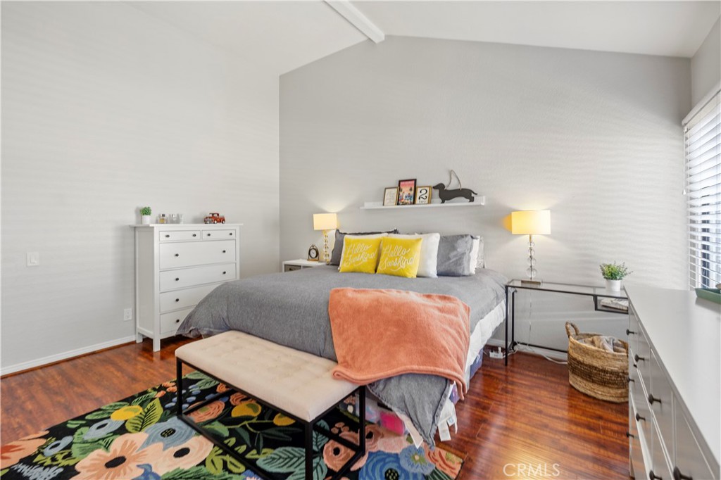 8520 Lake Knoll Avenue, Unit B Garden Grove, CA 92844 - Photo 21 of 31 a bedroom with a bed and wooden floor