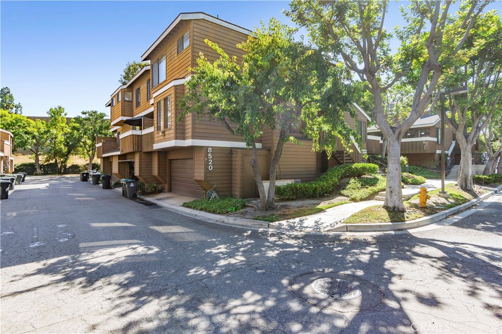 8520 Lake Knoll Avenue, Unit B Garden Grove, CA 92844 - Photo 3 of 31 a front view of a building with street view