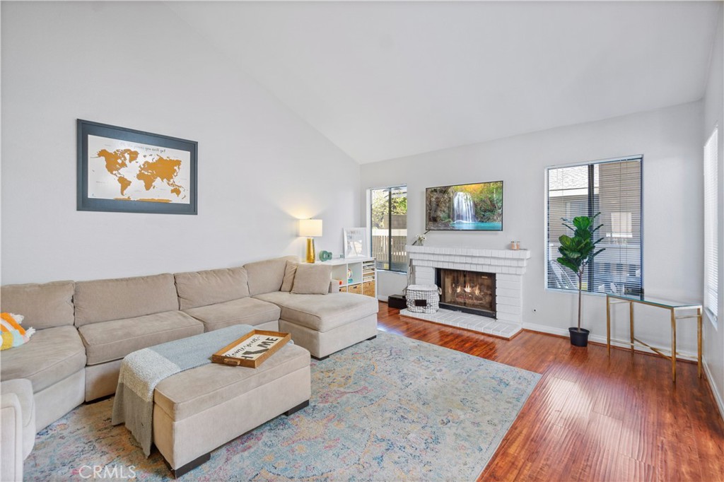 8520 Lake Knoll Avenue, Unit B Garden Grove, CA 92844 - Photo 4 of 31 a living room with furniture and a fireplace