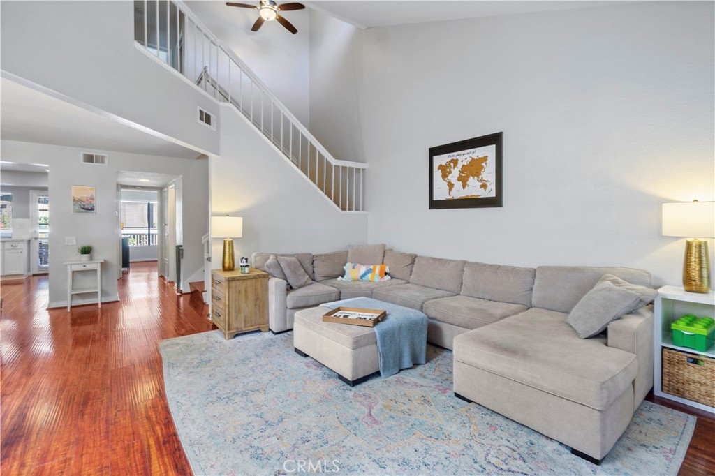8520 Lake Knoll Avenue, Unit B Garden Grove, CA 92844 - Photo 5 of 31 a living room with furniture and a wooden floor