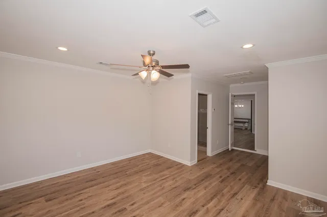 a view of a livingroom with wooden floor