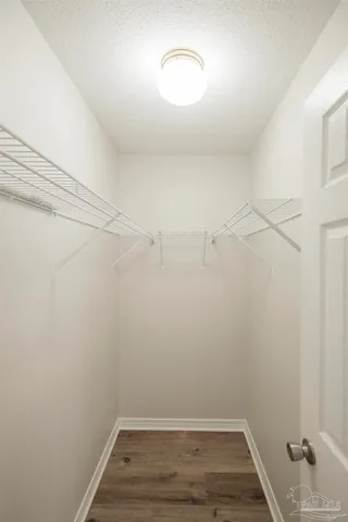 a view of a room with racks on the wall