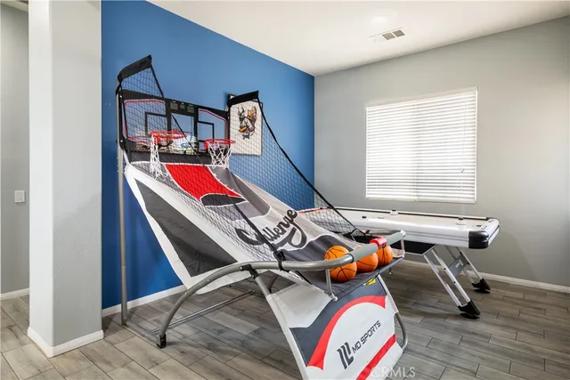 a room with furniture and air hockey table