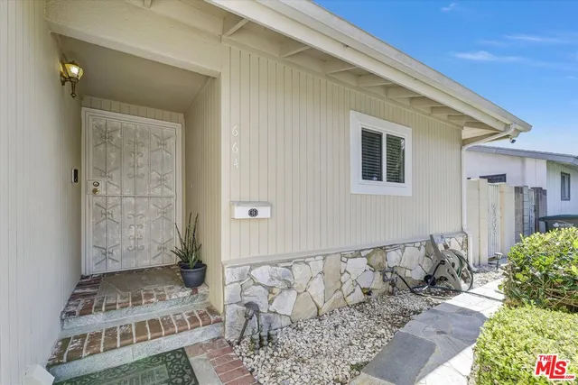 a view of a house with a wooden door