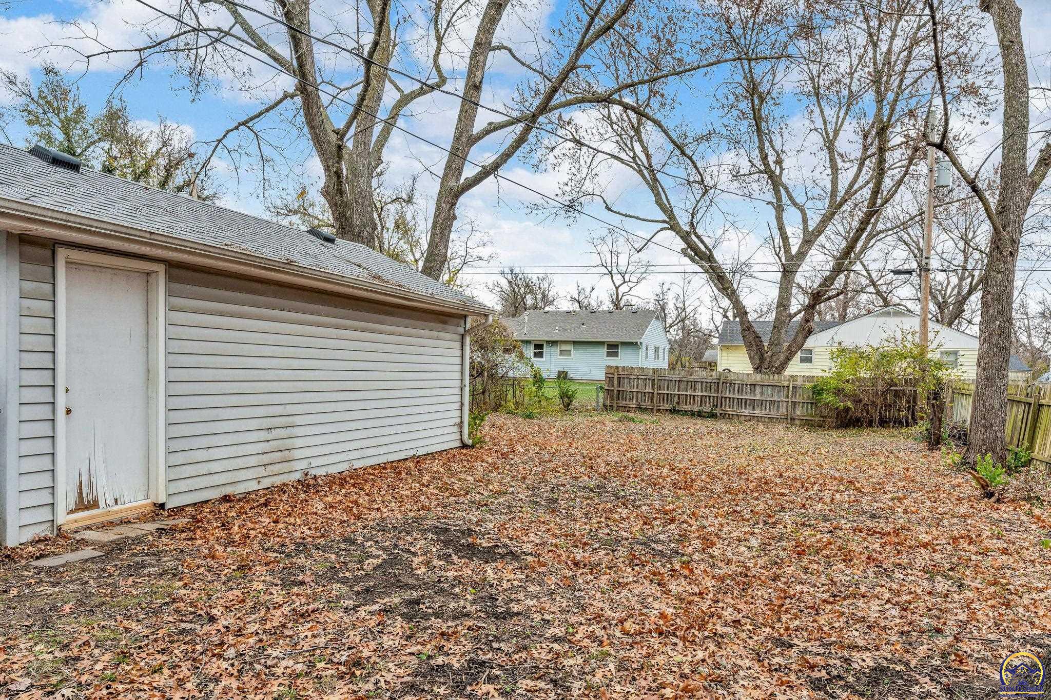 2212 Southwest Plass Avenue Topeka, KS 66611 - Photo 8 of 29 Backyard Entry into the Garage