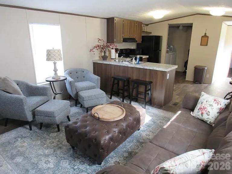 a living room with furniture and a table