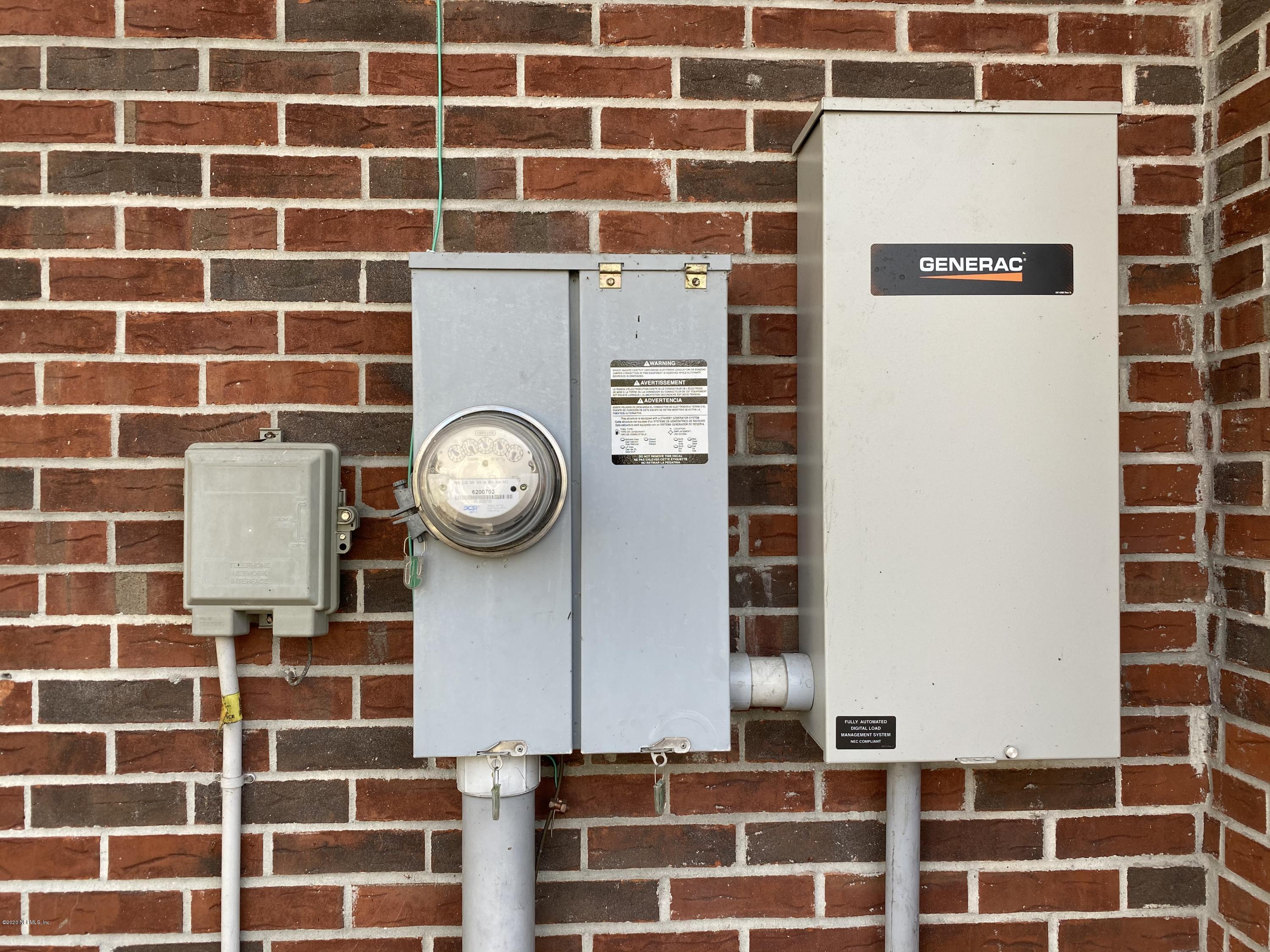 371283 Kings Ferry Road Hilliard, FL 32046 - Photo 27 of 35 Electric Meter and Generator Panel.