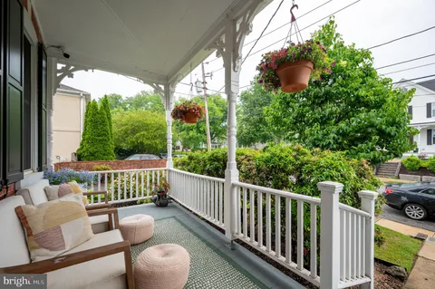 a front view of a house with a yard table and chairs