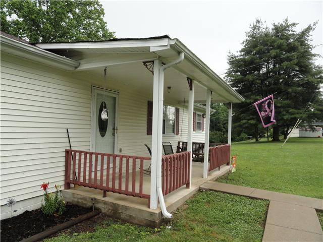 9360 Hodge Road Mount Pleasant, TN 38474 - Photo 3 of 20 Rocking chair covered Front Porch on a quiet road in the country.