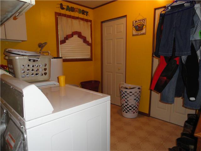 9360 Hodge Road Mount Pleasant, TN 38474 - Photo 8 of 20 This multi-purpose room serves a family three ways.. as a Laundry/Utility/Mud Room.