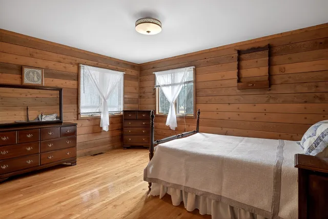 a bedroom with a bed and a dresser
