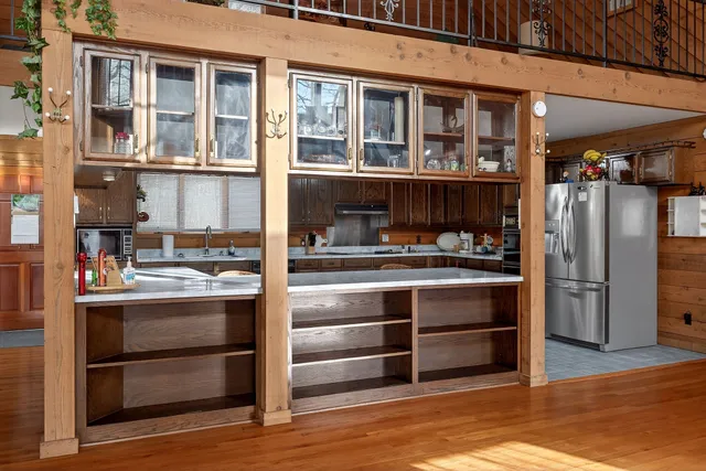a kitchen with a refrigerator and cabinets