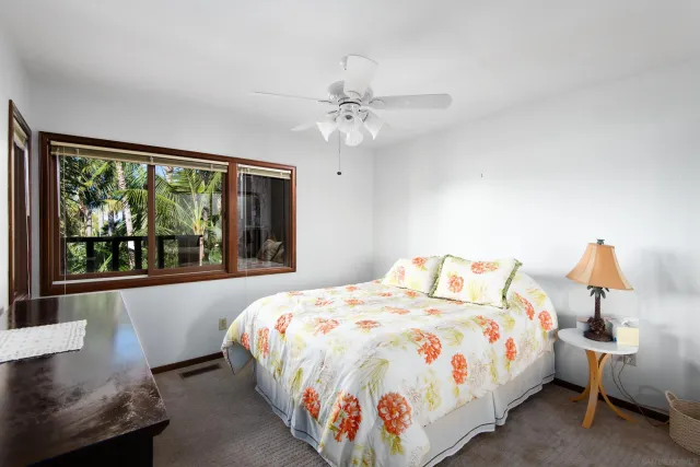 a bedroom with bed and window