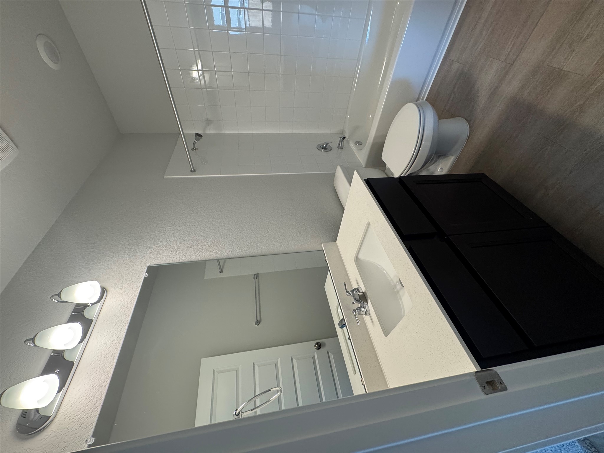 241 Alcatraz Loop Jarrell, TX 76537 - Photo 7 of 10 a bathroom with a toilet sink a mirror and vanity