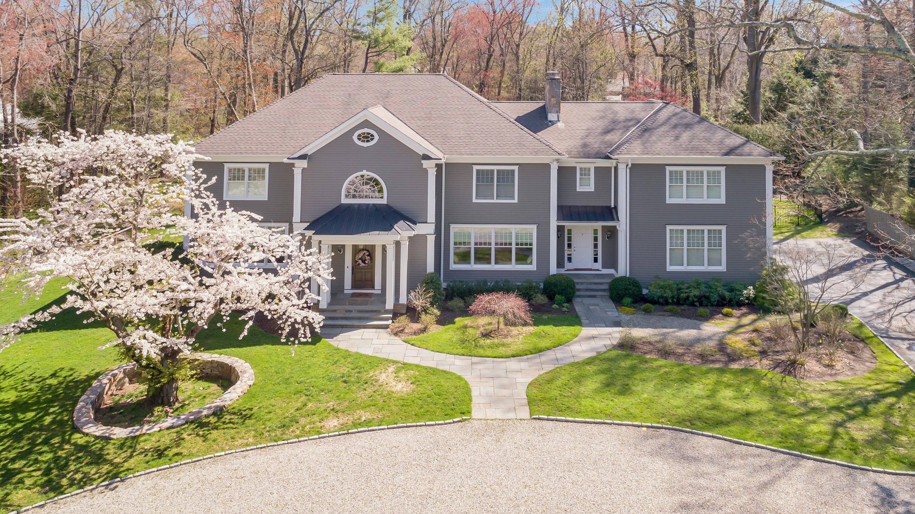 5 Old Parish Road Darien, CT 06820 - Photo 2 of 40 a front view of a house with a yard and garage