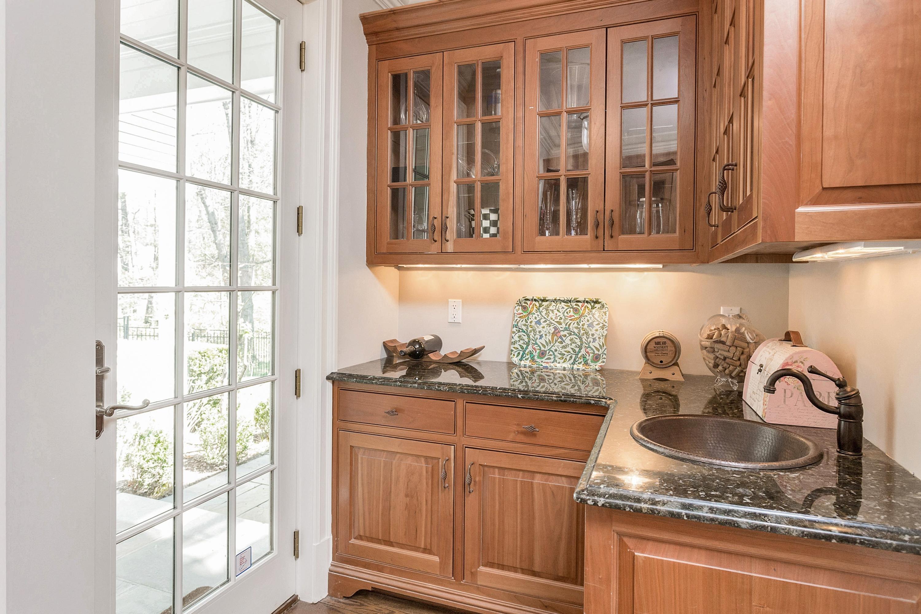 5 Old Parish Road Darien, CT 06820 - Photo 15 of 40 a kitchen with granite countertop a sink and a window