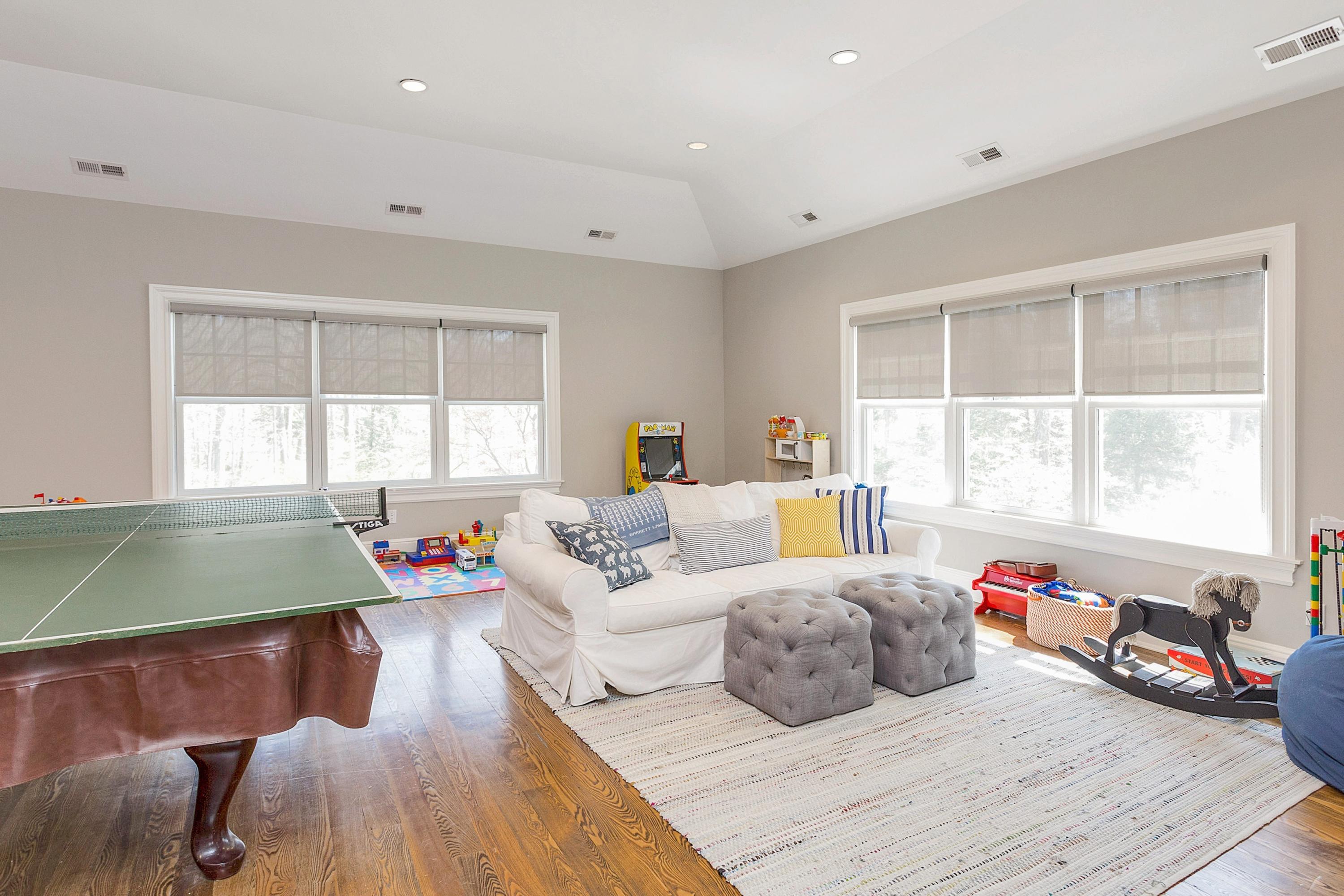 5 Old Parish Road Darien, CT 06820 - Photo 23 of 40 a bedroom with furniture and a large window