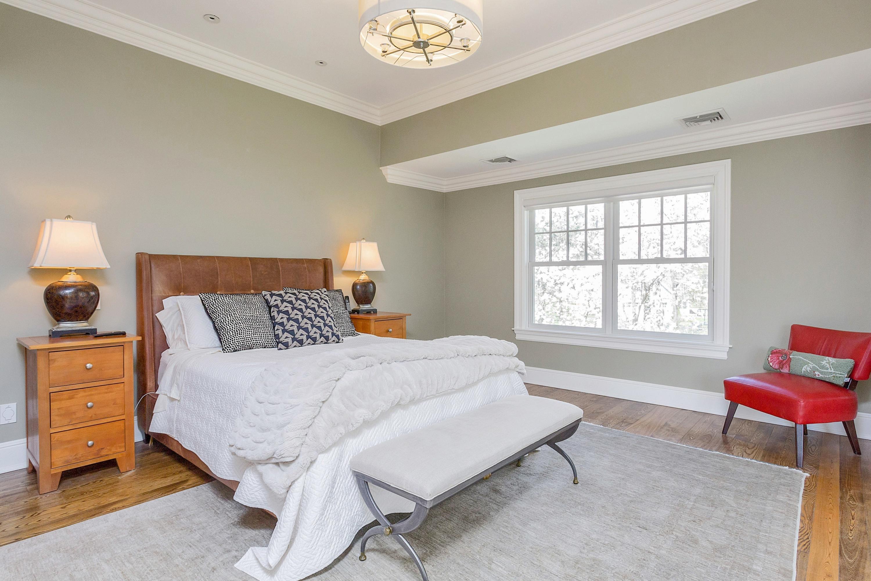 5 Old Parish Road Darien, CT 06820 - Photo 24 of 40 a bedroom with a bed and a window