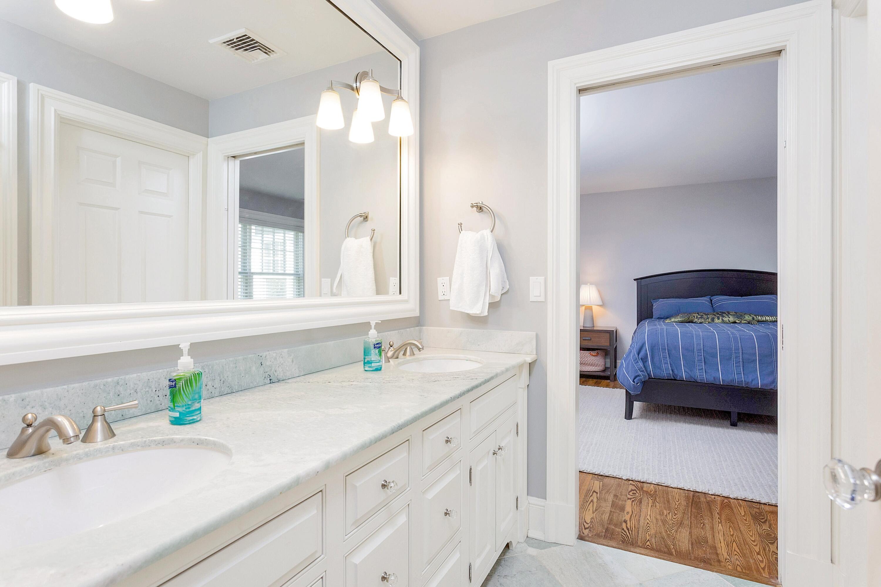 5 Old Parish Road Darien, CT 06820 - Photo 29 of 40 a en suite bathroom with a sink and a mirror