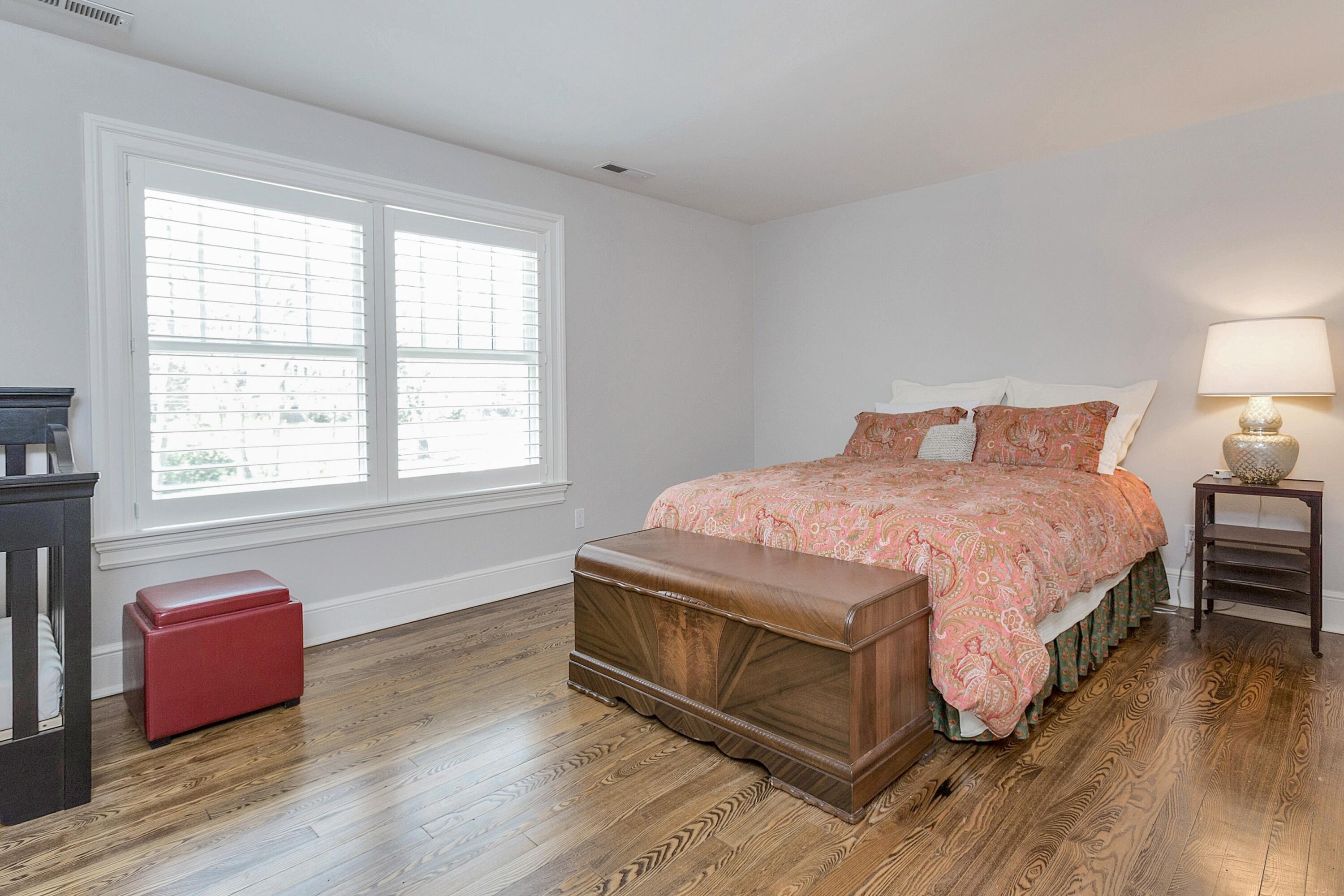 5 Old Parish Road Darien, CT 06820 - Photo 31 of 40 a spacious bedroom with a bed and wooden floor