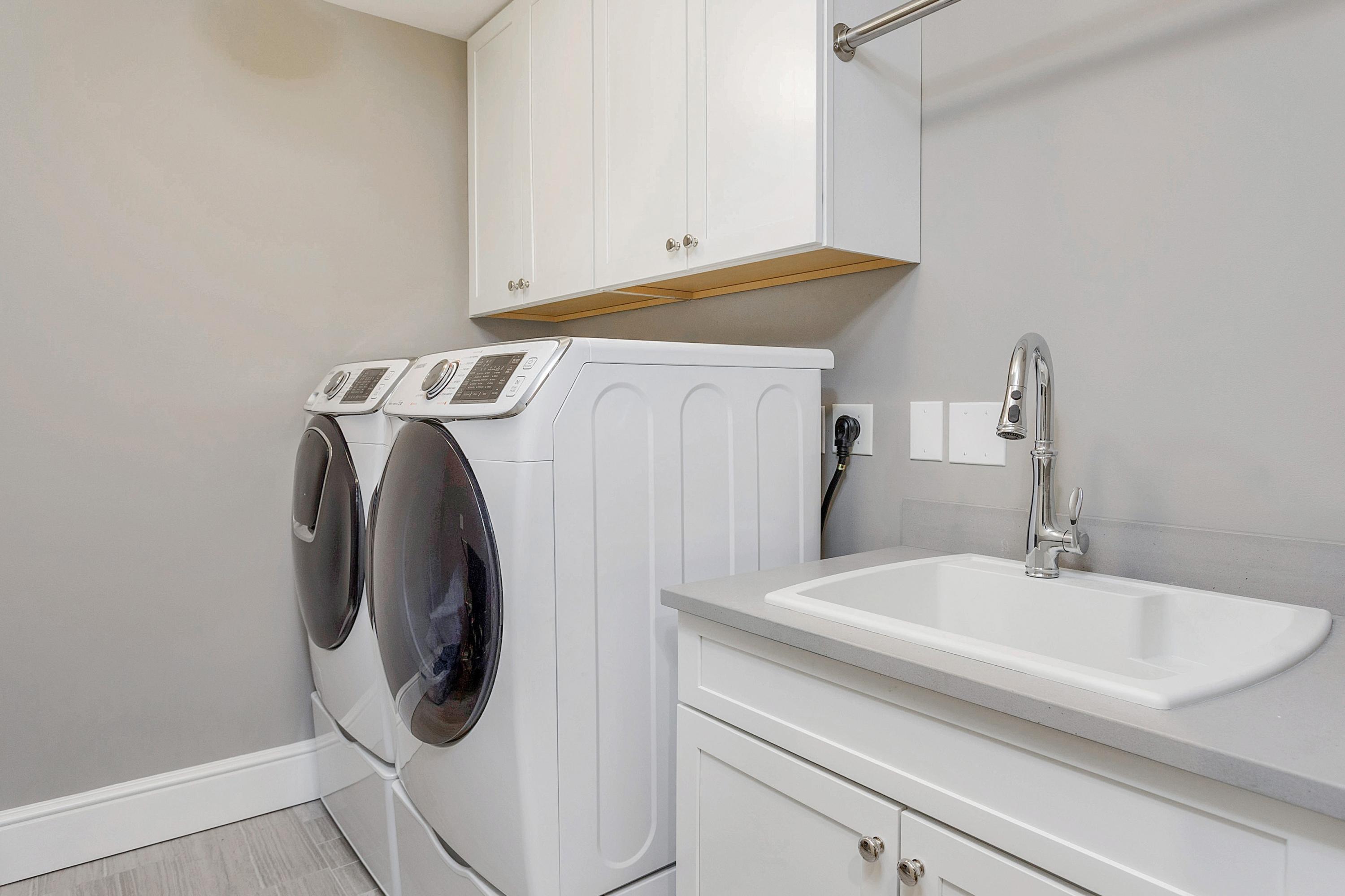 5 Old Parish Road Darien, CT 06820 - Photo 34 of 40 a close view of a utility room with dryer and washer