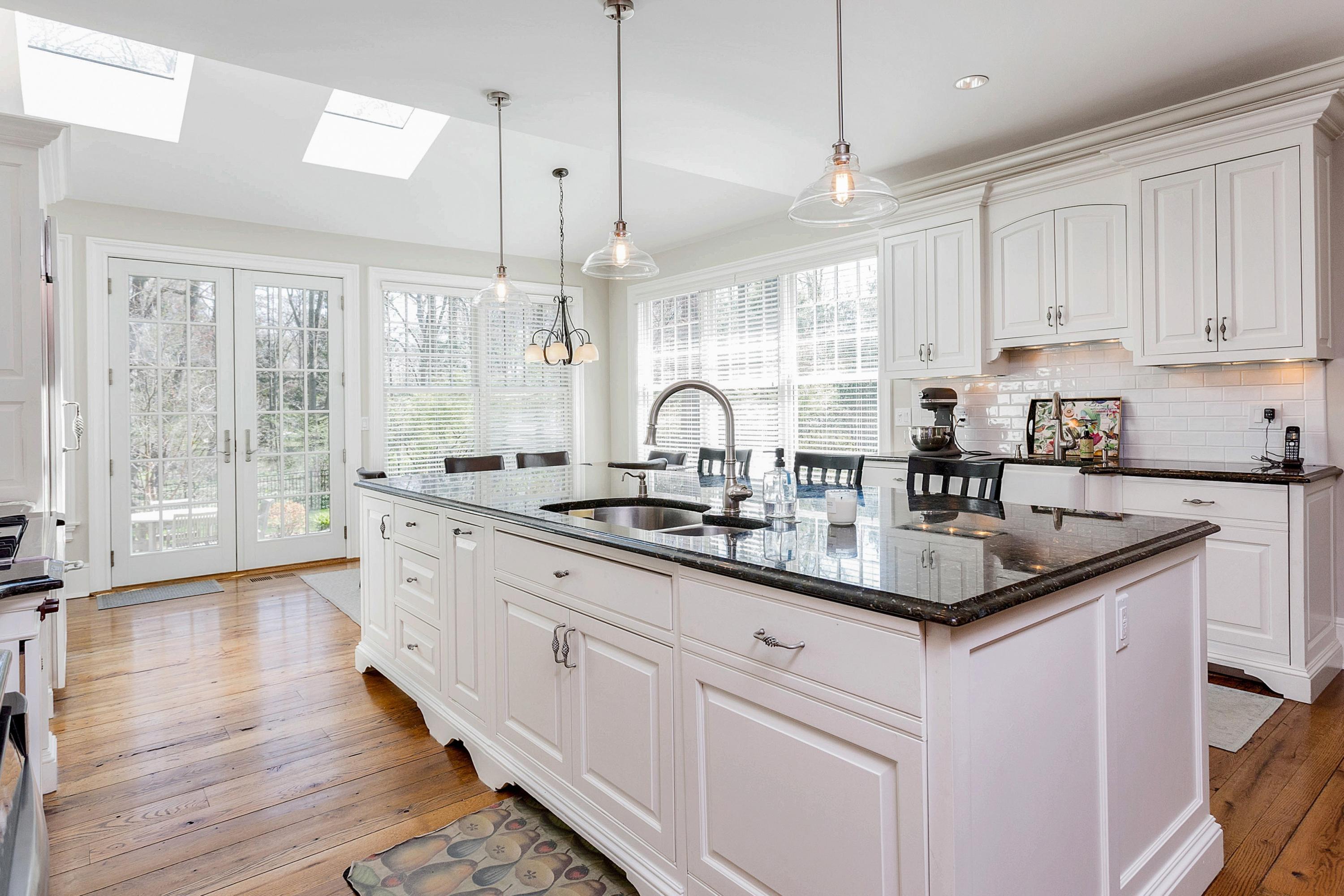 5 Old Parish Road Darien, CT 06820 - Photo 10 of 40 a kitchen with sink stove and cabinets