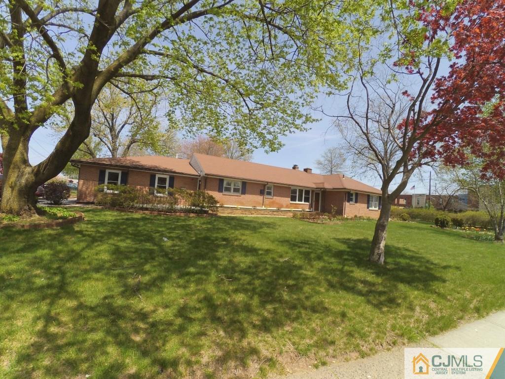 791 Hermann Road North Brunswick, NJ 08902 - Photo 10 of 14 a front view of a house with garden