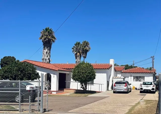 a front view of a house with parking