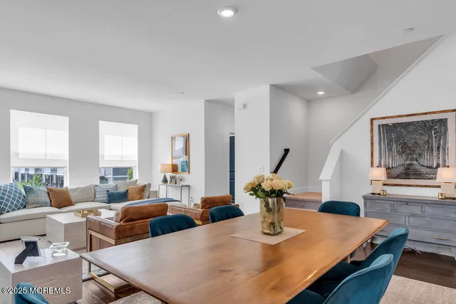 a kitchen with stainless steel appliances a stove microwave and sink