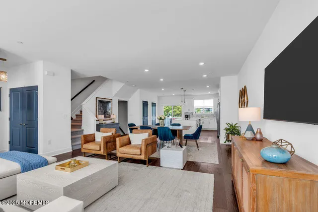 a view of a living room and kitchen
