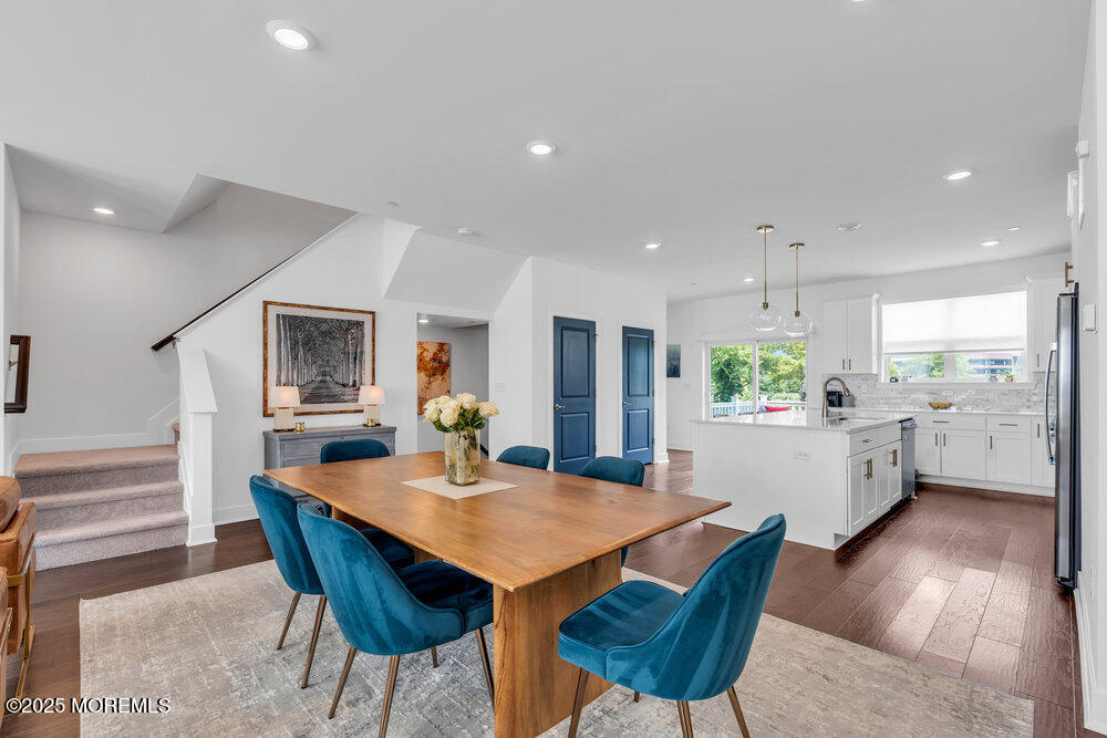 63 Bataan Avenue Tinton Falls, NJ 07724 - Photo 18 of 64 a view of a dining room with furniture and wooden floor