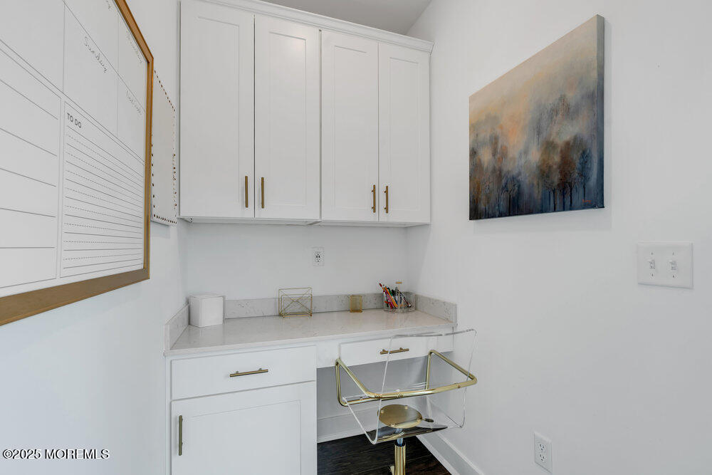 63 Bataan Avenue Tinton Falls, NJ 07724 - Photo 30 of 64 a view of cabinets a sink and dishwasher in a white cabinet
