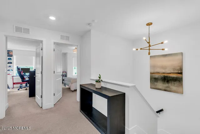 a view of a lake with a house in the background