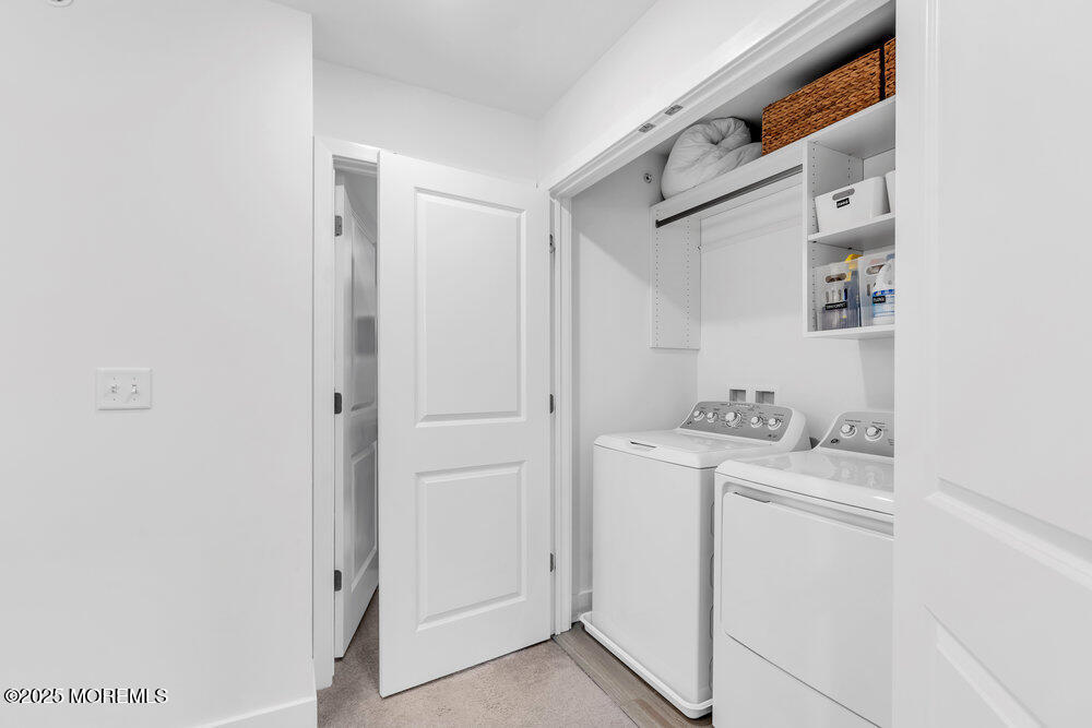 63 Bataan Avenue Tinton Falls, NJ 07724 - Photo 40 of 64 a utility room with dryer and washer