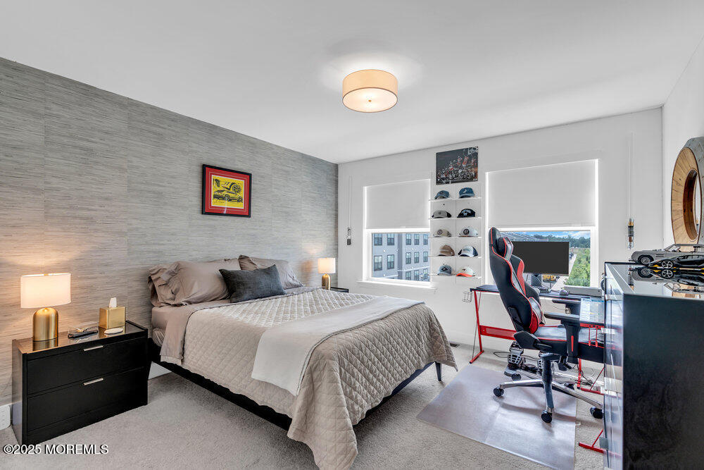 63 Bataan Avenue Tinton Falls, NJ 07724 - Photo 41 of 64 a bedroom with a bed and a table