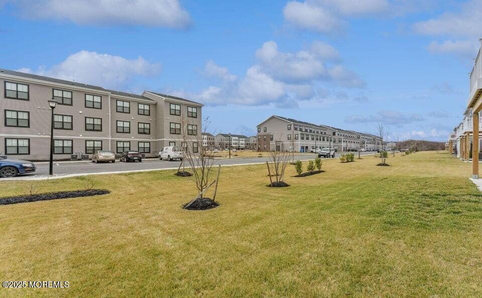 63 Bataan Avenue Tinton Falls, NJ 07724 - Photo 55 of 64 a swimming pool with outdoor seating and yard