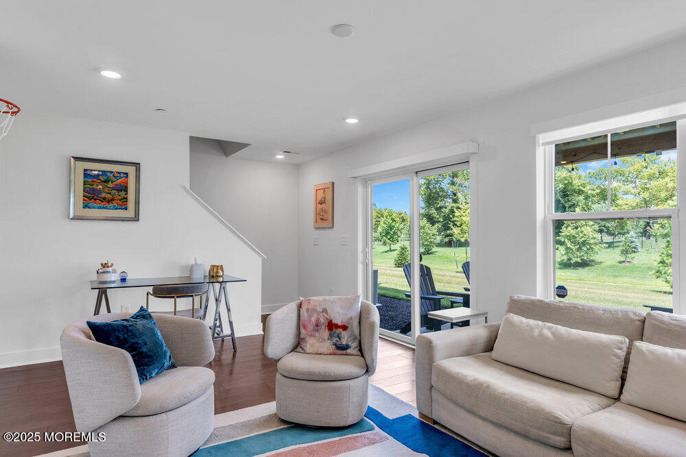 63 Bataan Avenue Tinton Falls, NJ 07724 - Photo 10 of 64 a living room with furniture and a large window