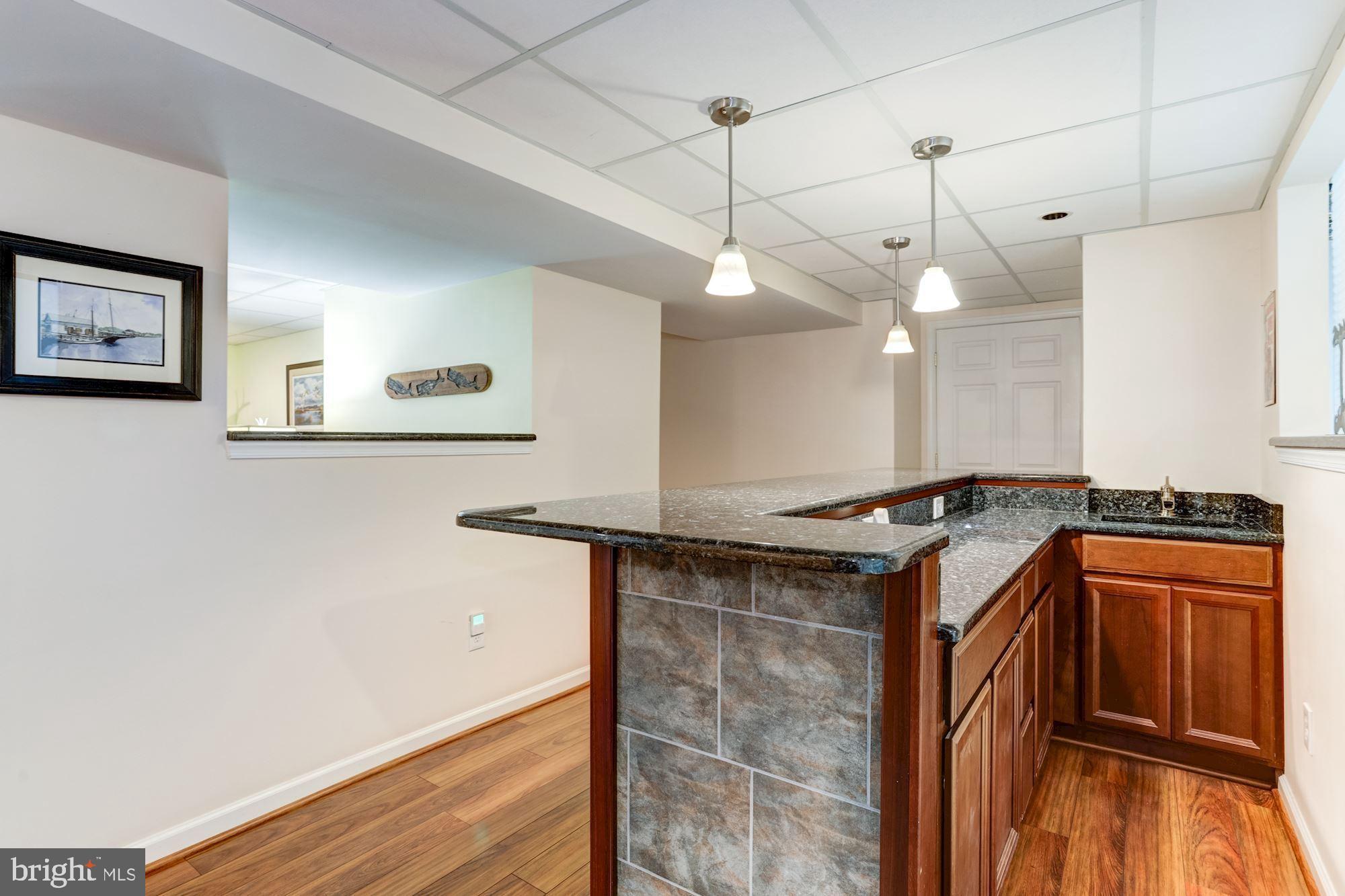 605 Havenhill Road Edgewater, MD 21037 - Photo 37 of 62 Lower Level, cherry flooring and beautiful wet bar