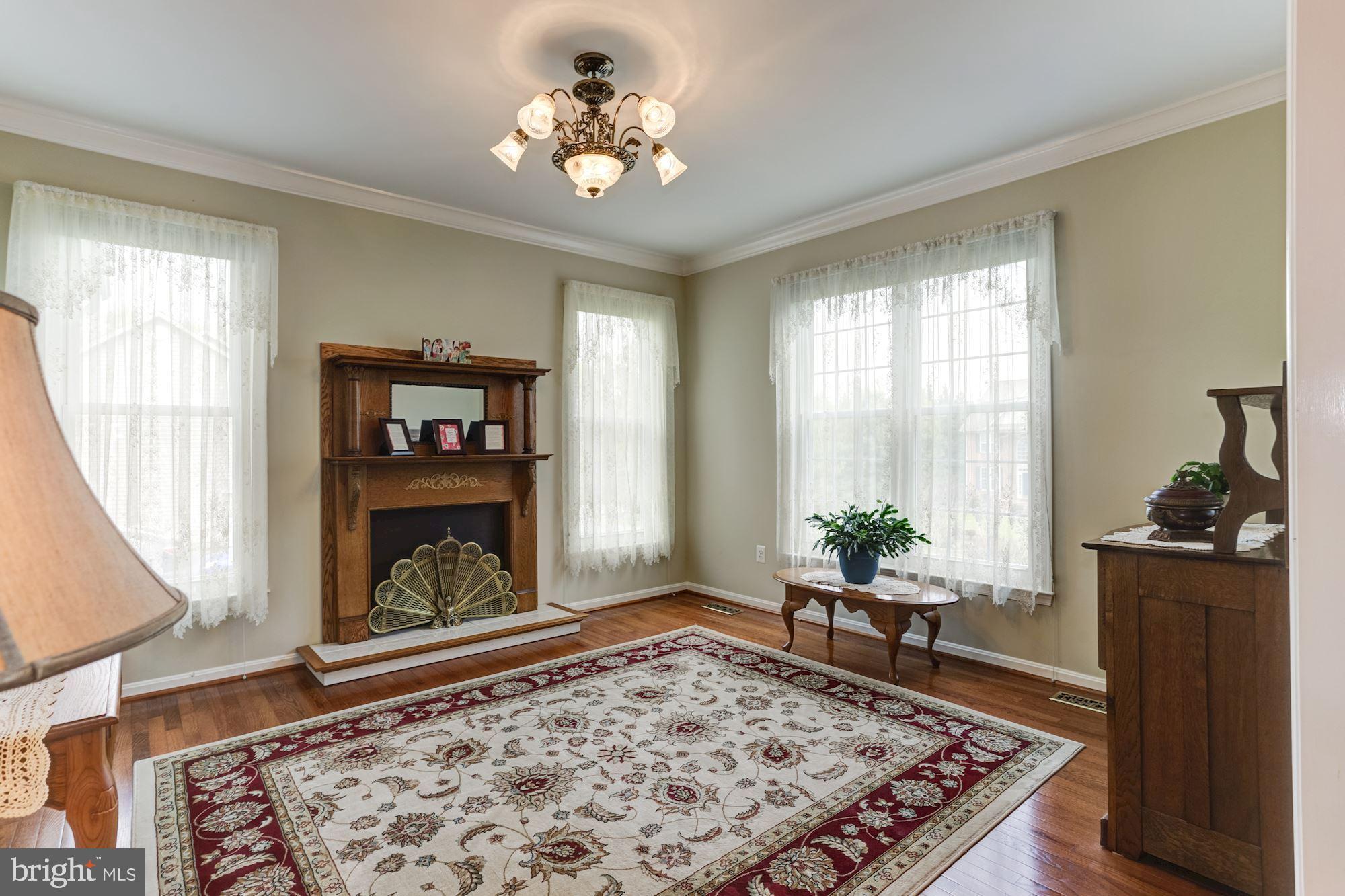 605 Havenhill Road Edgewater, MD 21037 - Photo 7 of 62 Living Room with crown molding & new windows